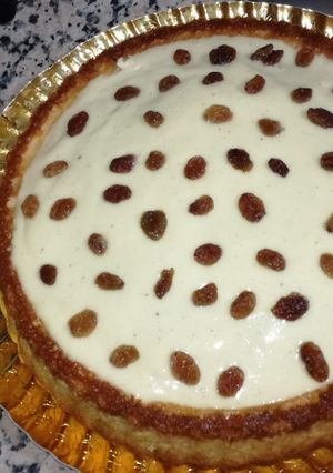 Una foto de Tarta de yogur con almíbar de naranja toronja y crema pastelera