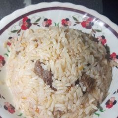 A picture of Rice with meat.