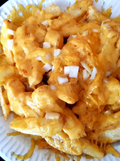 A picture of My Deep Fried Chips with Melted Cheese,Onion And Worester Sauce.
