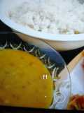 Boiled rice with daal and fries