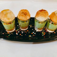 A picture of Golgappa paan cheese cake shots.