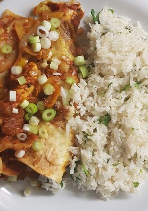 A picture of Vegetarian enchiladas with coriander lime rice.