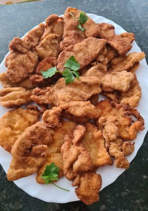 Una foto de 30. Pechuga de pollo empanada