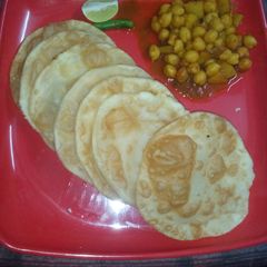 A picture of Paneer bature with chole.