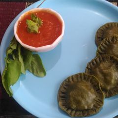 A picture of Spinach rivoli with tomato cream sauce.