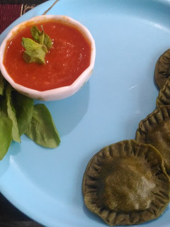 A picture of Spinach rivoli with tomato cream sauce.