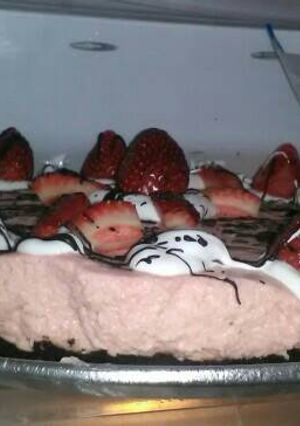 Una foto de Chessecake de frutilla y chocolate