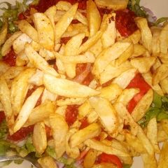 Chips with salad and sauce A picture of Chips with salad and sauce.