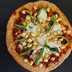 A picture of Capsicum Corn Cheese Pizza.