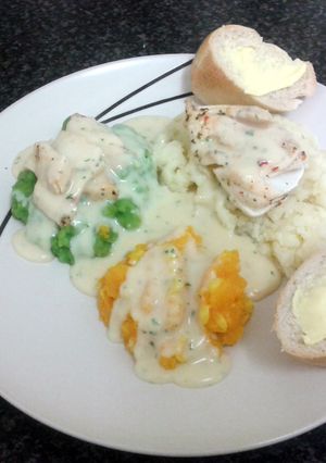 A picture of lemon & chilli cod loin with butternut squash & sweetcorm mash, minted peas, creamy potato & cream sauce.