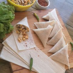 A picture of Chicken cheese samosas.