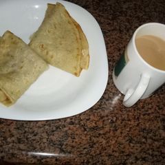 A picture of Breakfast pancake and Kenyan tea #Author marathon.