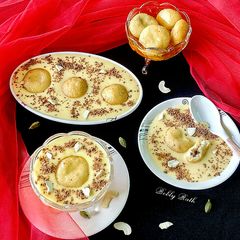A picture of Chocolate filled rasgulla in chilled custard.