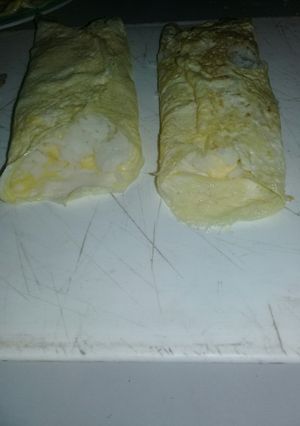 Una foto de Panqueque de huevo con arroz y queso