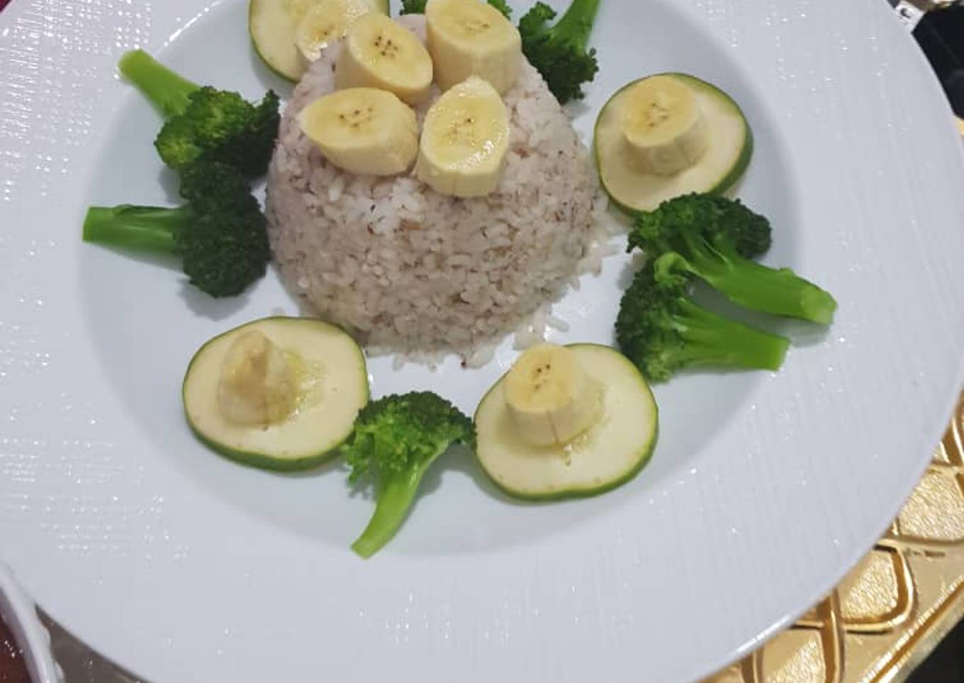 Ofada rice excited by broccoli, banana and cucumber