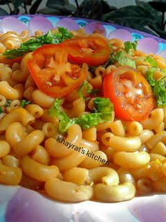 A picture of Pasta in hot tomato sauce.