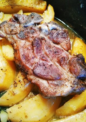 A picture of Pork Chops with Lemon Roasted Potatoes.