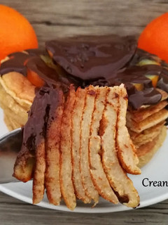 Una foto de Tortitas con naranjas confitadas