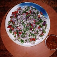 A picture of Garden tomato salsa with tortillas chips or papad chips🍟🍅🧅🫑.