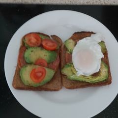 A picture of My Grilled Chopped Pork, Avocado,Tomato & Poached Egg on Toast.
