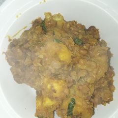 A picture of Porriage beans with unripe plantain and scent leaf.