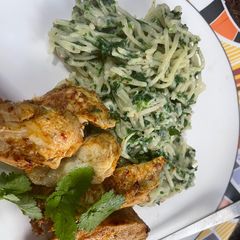 A picture of Grilled chicken with spinach carbonara.