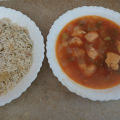 A picture of Chicken shashlik with vegetable fried rice.