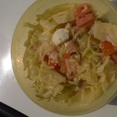 A picture of Cabbage with tomato salad.