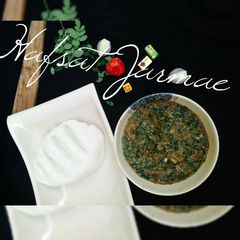 Shallow rice(tuwon shinkafa) with moringa soup A picture of Shallow rice(tuwon shinkafa) with moringa soup.