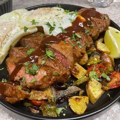 A picture of Chipotle BBQ NY Strip and Fried Eggs.