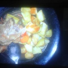 A picture of Roast potatoes and beef stew.