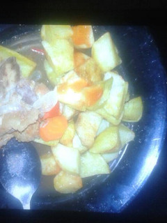 A picture of Roast potatoes and beef stew.