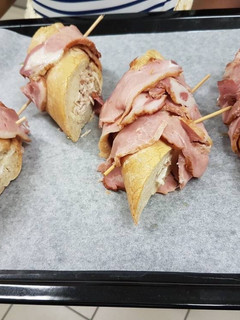 A picture of Bacon baguete stuffed with chicken and vanilla milk.