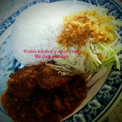 A picture of White rice with stew.