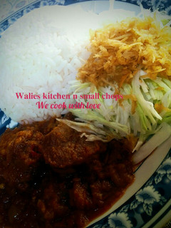 A picture of White rice with stew.