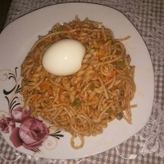 A picture of Jollof spaghetti with macaroni with mixed vegetable.