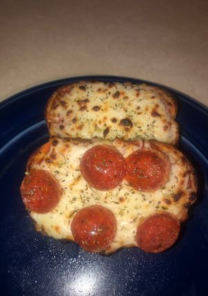 A picture of Garlic bread personal pizzas.