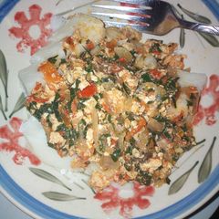 A picture of Boiled yam with vegetable egg sauce.
