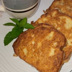 A picture of Bread in egg with mint tea.