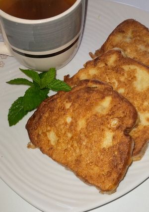 A picture of Bread in egg with mint tea.