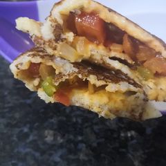 A picture of Schezwan paneer dosa.