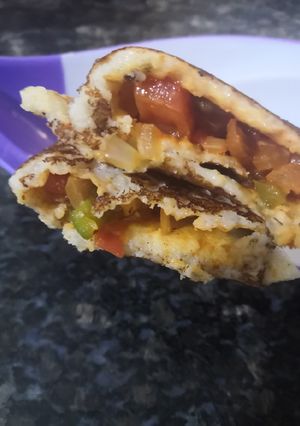 A picture of Schezwan paneer dosa.