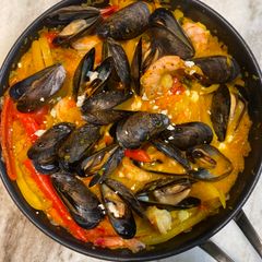 A picture of Shakshuka with Shrimp and Mussels.