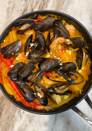 A picture of Shakshuka with Shrimp and Mussels.