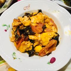 A picture of Tomato and egg stir fry.