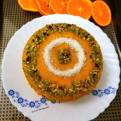 A picture of Basbousa soaked in Orange & Honey syrup.