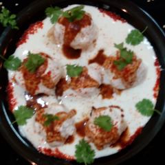 A picture of Cheesy Corn Dahi Vada.