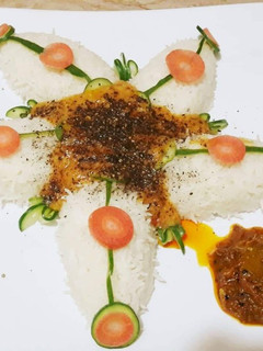 A picture of Moong dal With boiled wite Rice and Shan Achar.