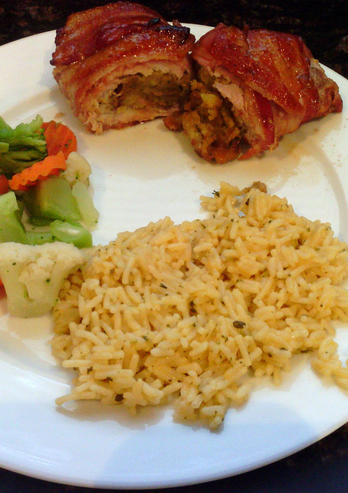 A picture of Bacon wrapped stuffed pork chops.