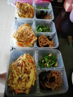 A picture of Pumpkin Rice with omelet, mix vegetables.